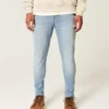 Lysvasket atletisk skinny jeans