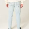 Lysvasket atletisk skinny jeans