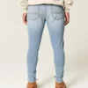 Lysvasket atletisk skinny jeans