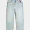 Lysvasket skaterjeans med spillkortgrafikk