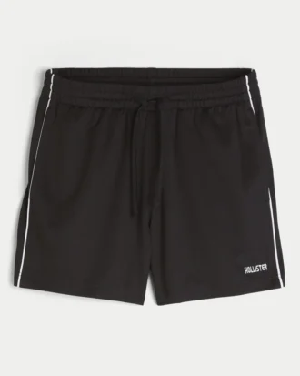 Midt-lårstrikkede fotballshorts med logo