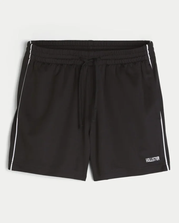 Midt-lårstrikkede fotballshorts med logo