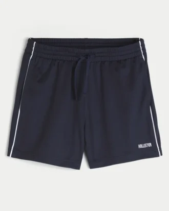 Midt-lårstrikkede fotballshorts med logo