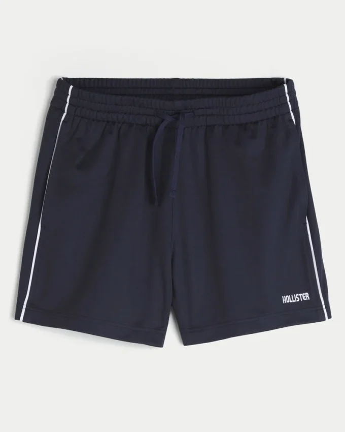 Midt-lårstrikkede fotballshorts med logo