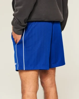 Midt-lårstrikkede fotballshorts med logo