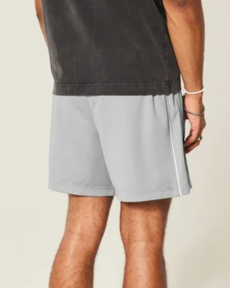 Midt-lårstrikkede fotballshorts med logo