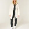 Pufferparkas med fuskepelsfôr