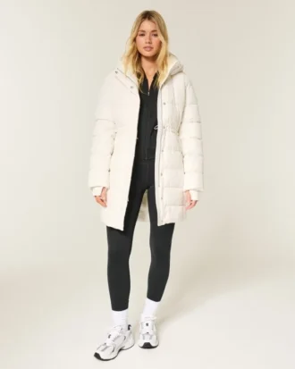 Pufferparkas med fuskepelsfôr