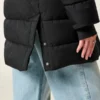 Pufferparkas med fuskepelsfôr