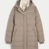 Pufferparkas med fuskepelsfôr