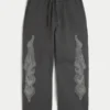 Superbaggy joggebukse med dobbelt flamme-grafikk