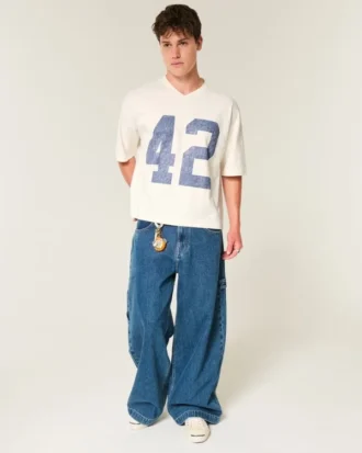 Tung baggy kort fotball-T-skjorte med grafikk