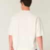 Tung baggy kort fotball-T-skjorte med grafikk