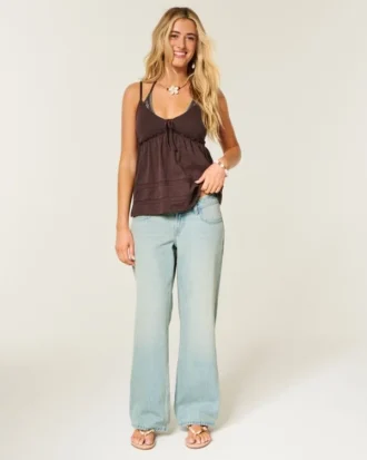 Ultra lav midje, lys vask, baggy jeans med spenne bak