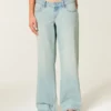 Ultra lav midje, lys vask, baggy jeans med spenne bak