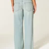 Ultra lav midje, lys vask, baggy jeans med spenne bak