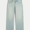 Ultra lav midje, lys vask, baggy jeans med spenne bak