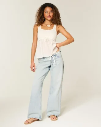 Ultra lav midje, lys vask, mini linning, baggy jeans med snøring