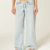Ultra lav midje, lys vask, mini linning, baggy jeans med snøring