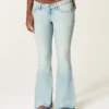 Ultra lav midje, lys vask, nedsenket hem, flare jeans