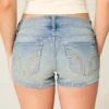Ultra lav midje, medium vasket denim shorts