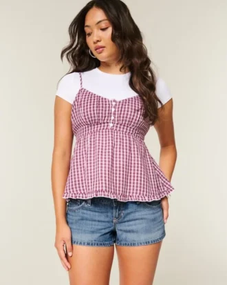 Ultra lav midje, slitt mediumvasket denim minishorts