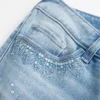 Ultra lavt sittende, slitt, lysvasket jeans med paljetter