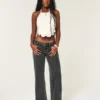Ultra lavt sittende, vasket svart baggy jeans med spenne bak