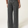 Ultra lavt sittende, vasket svart baggy jeans med spenne bak