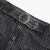 Ultra lavt sittende, vasket svart baggy jeans med spenne bak