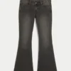 Ultra lavt sittende, vasket svart flare-jeans