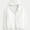 Vendbar fleece-hoodie med glidelås og fuskepelsfôr
