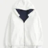 Vendbar fleece-hoodie med glidelås og fuskepelsfôr